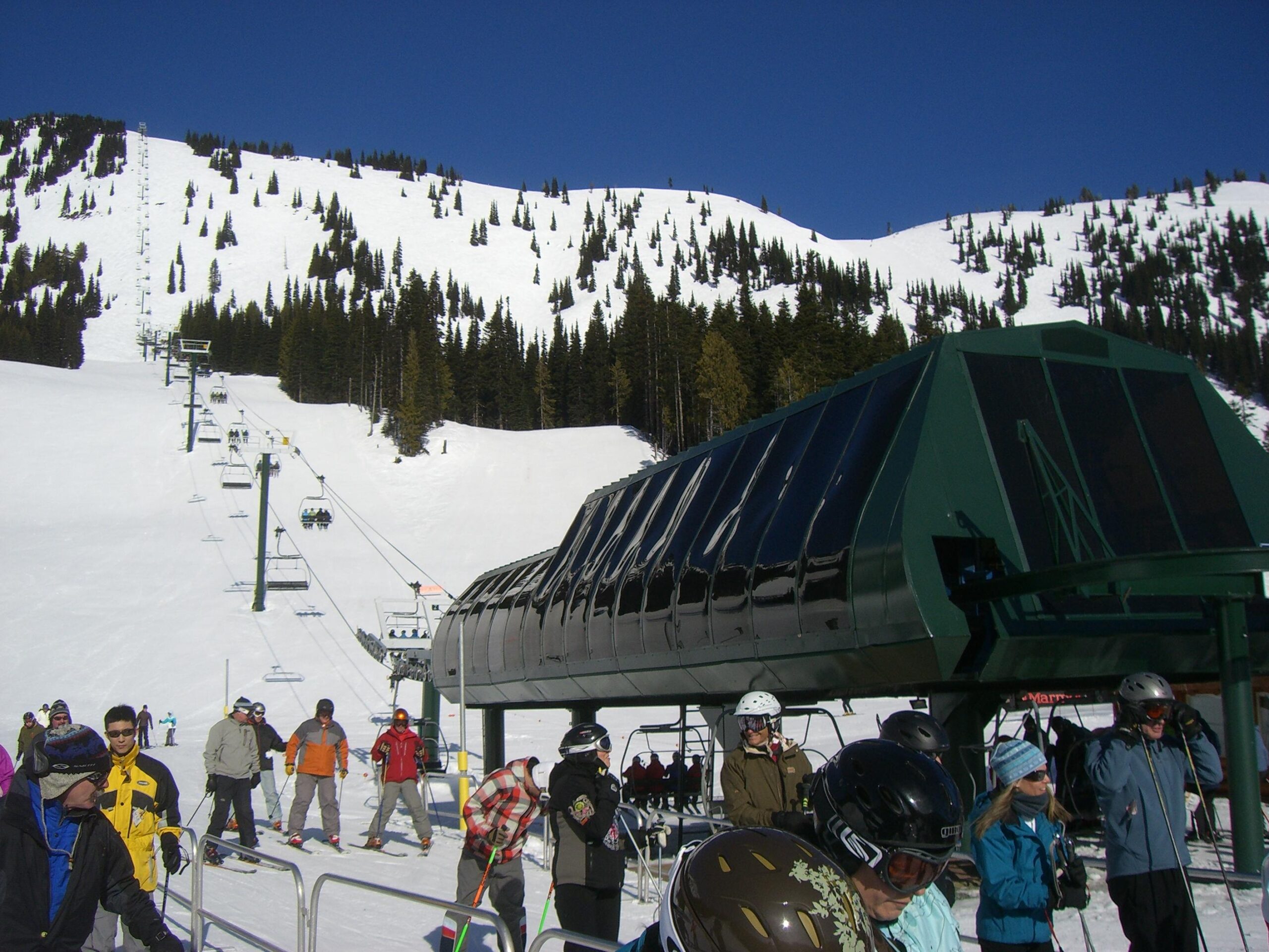 Crowd of skiers wait in line in 2010 to take their ride up the REX chairlift.