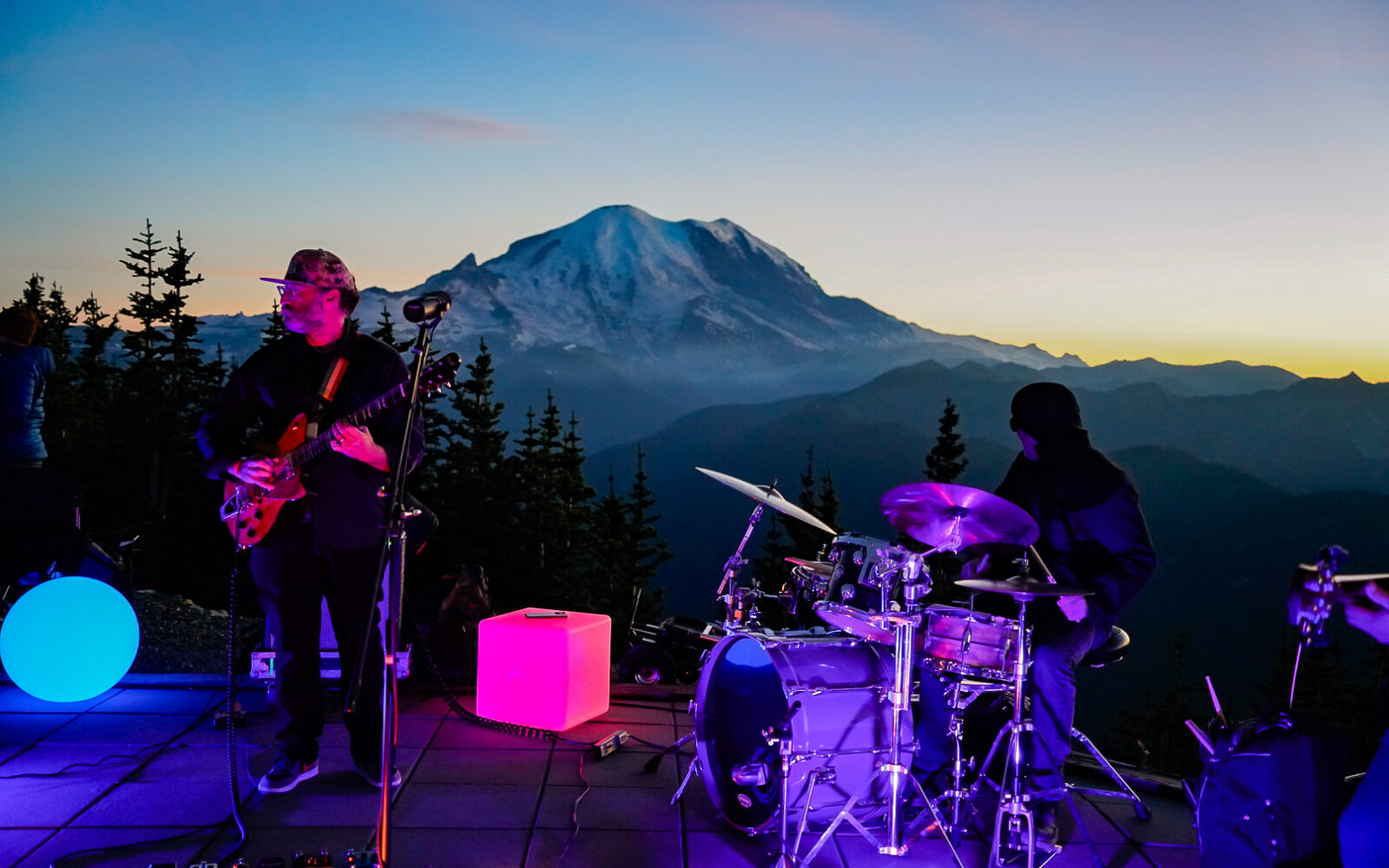 Band plays on Mt. Rainier platform at sunset.