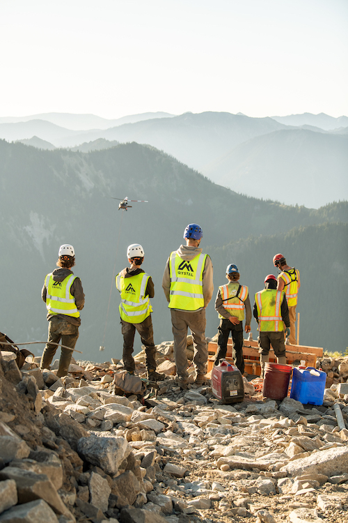 The Crystal Rex Crew sizes up the valleys below for the installation of a new lift.