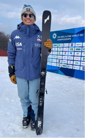 A person holding a ski