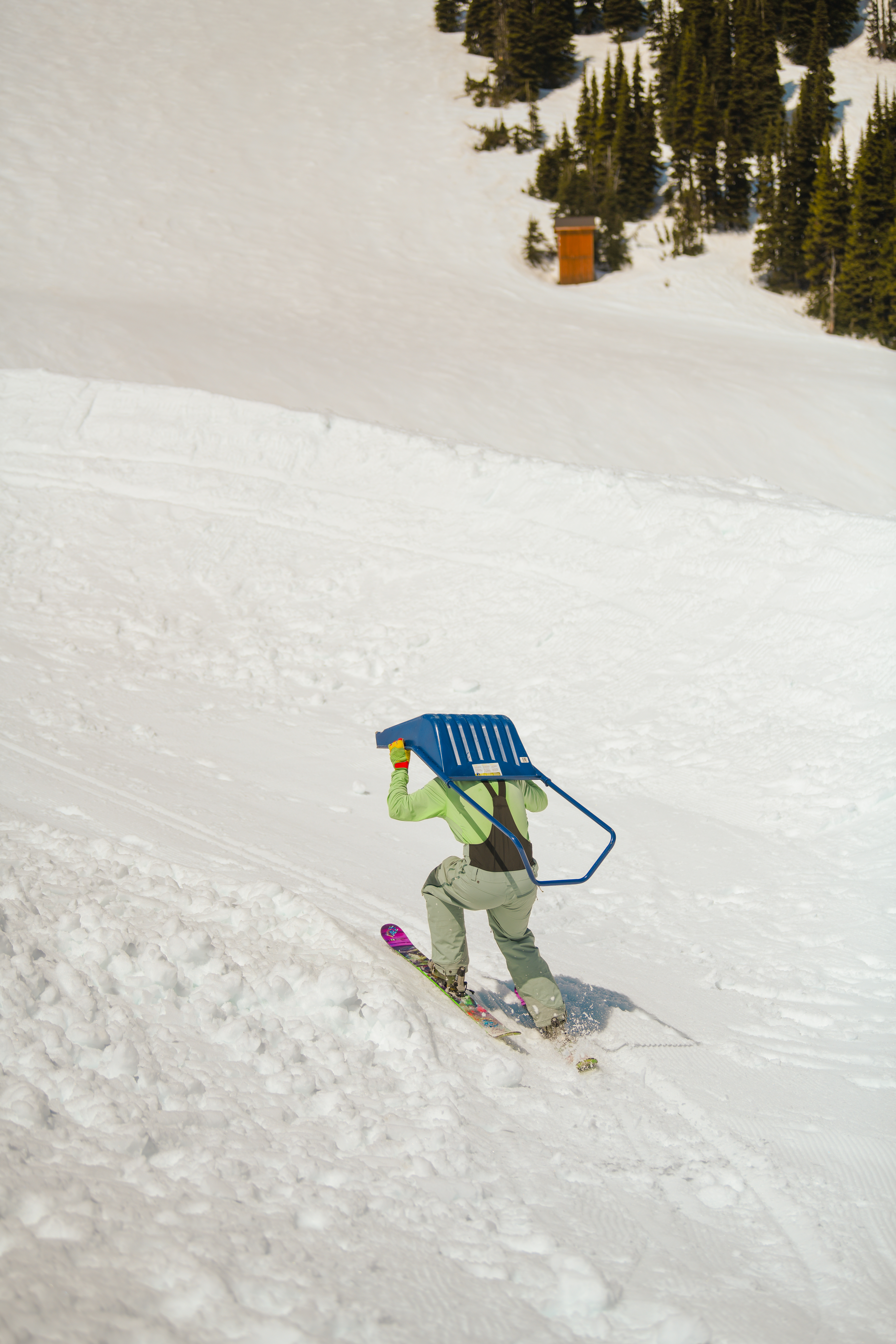 Dig crew volunteer Noah compacting the build