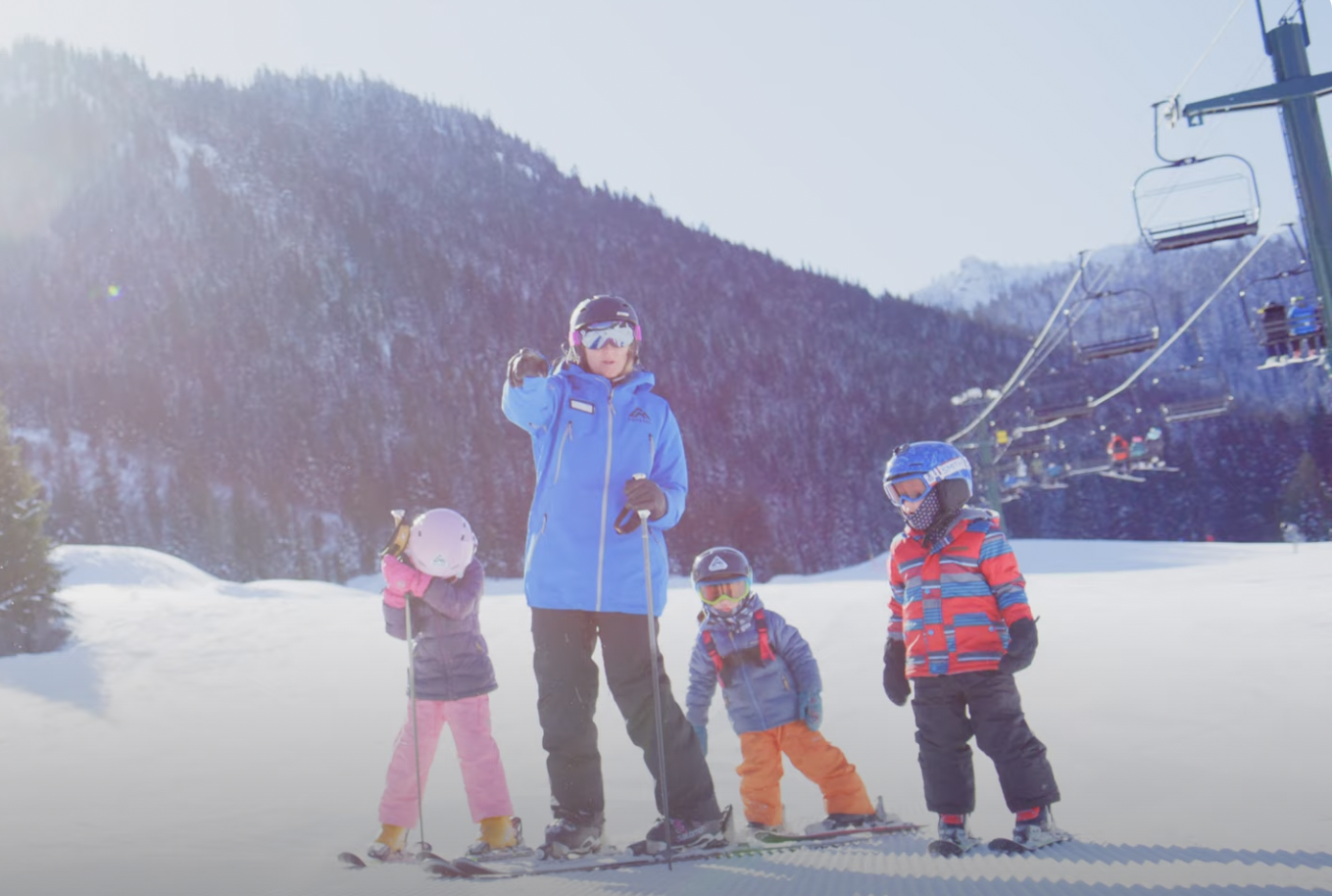 Kids enjoying a full day of ski or snowboard instruction at Crystal Mountain